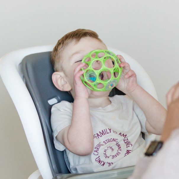 baby playing with family