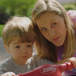 mother and son looking off into the distance