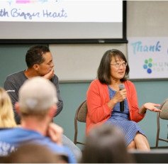 panel speaking to group of listeners