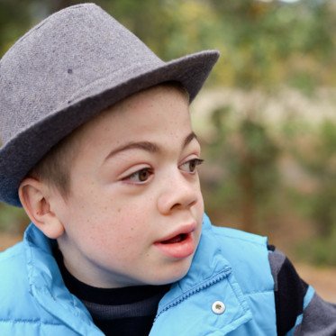 boy in fedora and blue vest