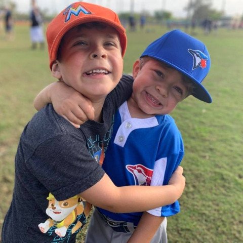 Sebastian and friend playing baseball