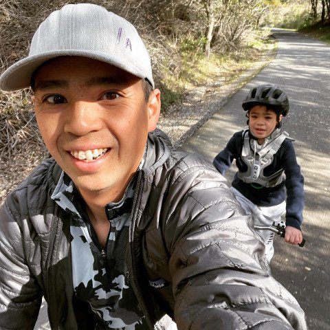 Noah bike riding with his dad