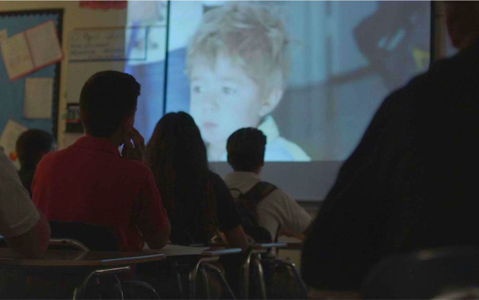 classroom watching video of Project Alive's mission